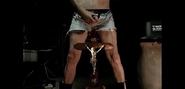 666 BLASPHEMIC PISS ALL OVER FUCKING CRUCIFIX IN SEXY USED JEANSSHORT, BLACK SPANDEX STRING AND BOOTS. SMOKING